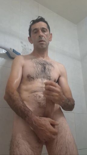 Straight guy with a huge cock jerks off in the shower until he gets all the milk out.   Clip 3