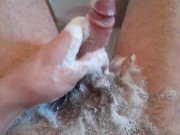 Extremely horny teen washes his dirty cock with shampoo in the bathtub