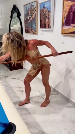 Blonde woman in a bikini playing pool
