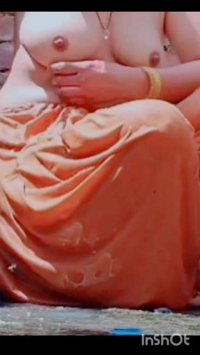 While Bathing, the Village Woman Is Taking a Bath Naked After Taking off Her Clothes Completely