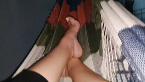 The feet of the beautiful lady reveals her pronounced arches as she relaxes (7)