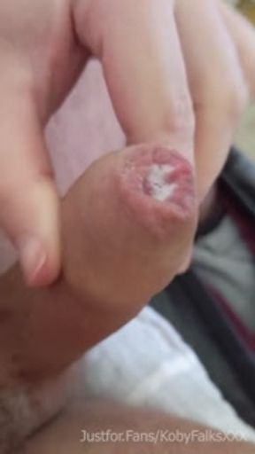 Rugged bear wearing baseball cap wanks and blows on mirror