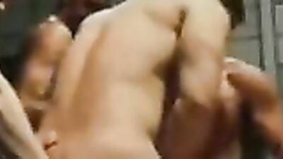 Behind the bars: Muscular hunk enjoys group sex with a group of guys