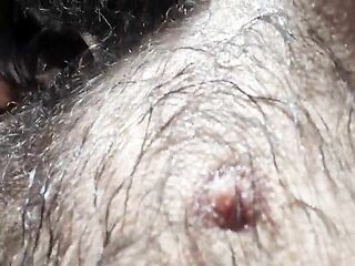 Close-up of the bushy, perspired body after training, beard and hair.