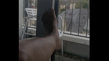 wanking at the hotel window