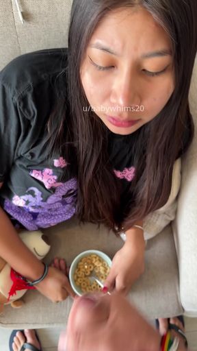 Woman eating cereal
