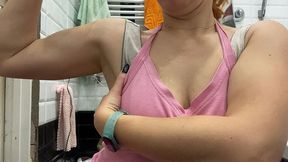 strong woman shows her muscles and armpits