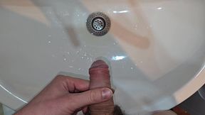 Male pissing compilation - POV pee to the bathroom sink. Strong and long peeings