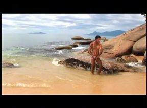 Anal doggy-style on the beach under the sun