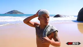 Giving it to the well-endowed guy on the nudist beach!