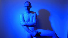Kudoslong nude in a blue light playing with his flaccid cock