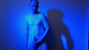 Kudoslong nude in a blue light playing with his flaccid cock