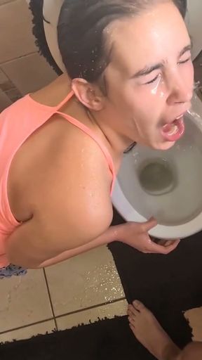 Human toilet girl gets her face soaked with piss over the toilet   Clip 1