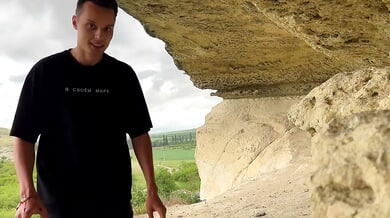 Brown-haired woman with big ass gets deep throat in rocky cave during hike
