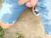Piss on self and onto ground with uncut cock on outdoor path
