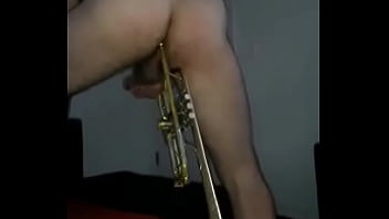 Professional musician ass fucked with trumpet by female friend