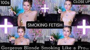 A stunning blonde who smokes 100s cigarette like a pro—blowing smoke with her mouth open and a smile that will make you fall in love