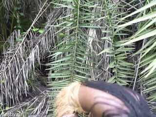 Sexy Afro native woman cooking in the jungle