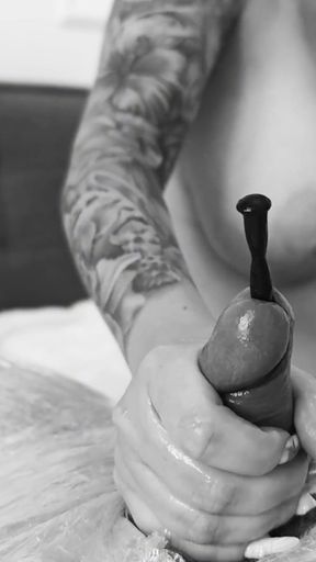 Femdom. a Busty Dominatrix Inserts Dilators Into a Stretch-wrapped Sex Slave's Urethra Until He Orgasms.