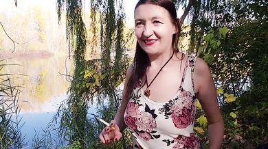 Gypsy Dolores smokes red lips in Angrignon Park while flashing risky outdoor nudity