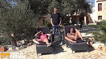 Two tattooed babes get their pierced and shaved cunts screwed outside by a man with hard cock