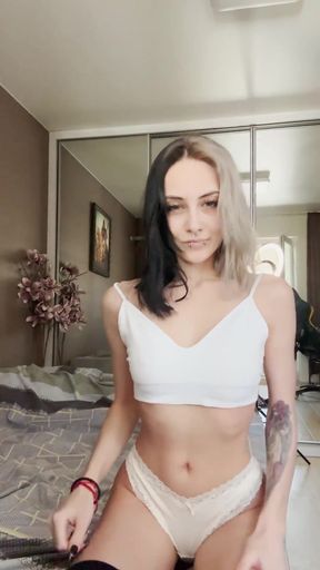 Goth babe with natural tits shows off her pierced body