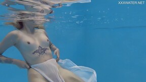 Finnish babe swims nude in the pool