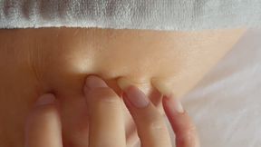 Long, natural fingernails trimmed to make pointed talons