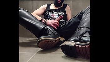 Masturbation in leather and mask