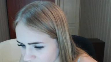 Pensive Faith Mcclure Looking Intently into Her Computer