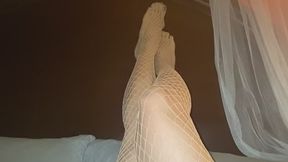 29. Melove Sexy legs in White Fishnet and dark nail polish