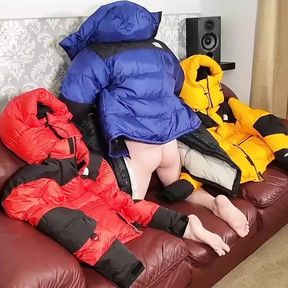 HumpingNorth Face Baltoro Down Jackets on Leather Couch Sofa.