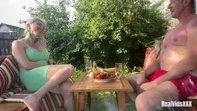 On a warm, summer day, a mature couple enjoys sex outside their house