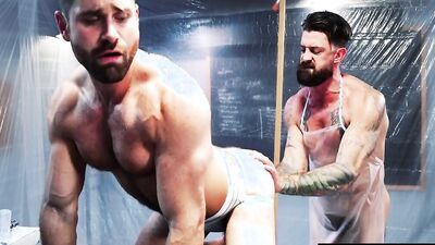 Two buff studs with beards and muscles use kinky toys for pleasure