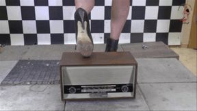 Old historical Radio crushed under high heel Boots