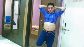 Cute sissy crossdresser femboy Sweet Lollipop in a denim jeans, crop top, sunglasses and flip-flop.