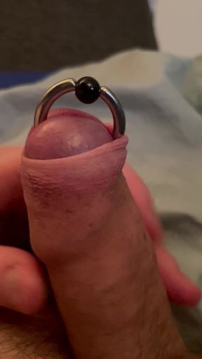 Rolling foreskin over piercing