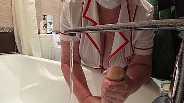 Big tits under a medical gown. A work camera watches a mature nurse in the bathroom.