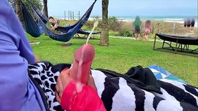 Big-titted MILF shows off her big cock-handling skills in a public beach closeup