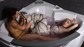 Alexa and Bianca: barefoot blonde girl, wrapped in cloth and bound with rope, is being tickled and teased by roommate in jacuzzi (HD MOV)