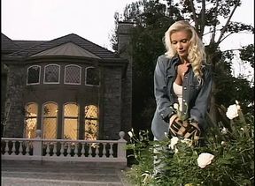 Blond slut gets pounded by a woman with a strap on while she blows her man&#039;s cock
