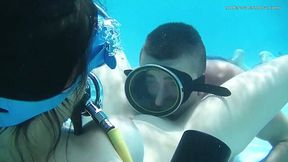 Horny diver is licking plump pussy under the water