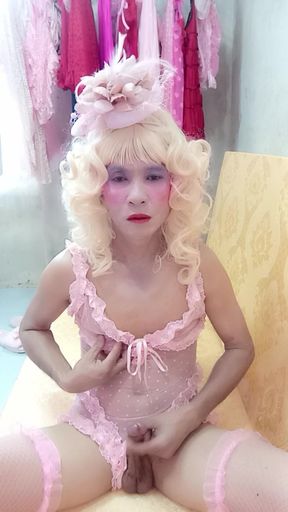 Oanh Le transgender wearing sexy porn clothes playing with a fake can