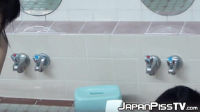 Playful Japanese chicks filmed pissing while taking a shower