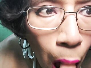 Lascivious trans beauty on camera sucking a rubber ramrod.