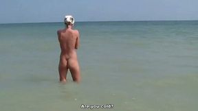 Amateur blonde lets a guy play with her holes on a beach