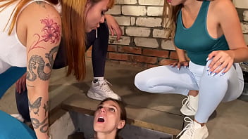 Three Girls Spitting On A Slave Captive In Dirty Basement