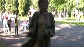 Cute and slender white teen wears nothing underneath raincoat