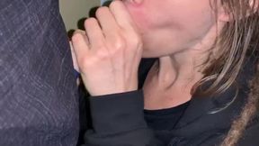Sluttish dreadlock babe mouths cock in public parking lot