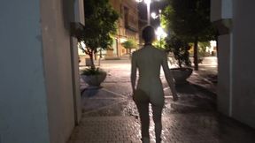 Walking completely naked towards a busy street